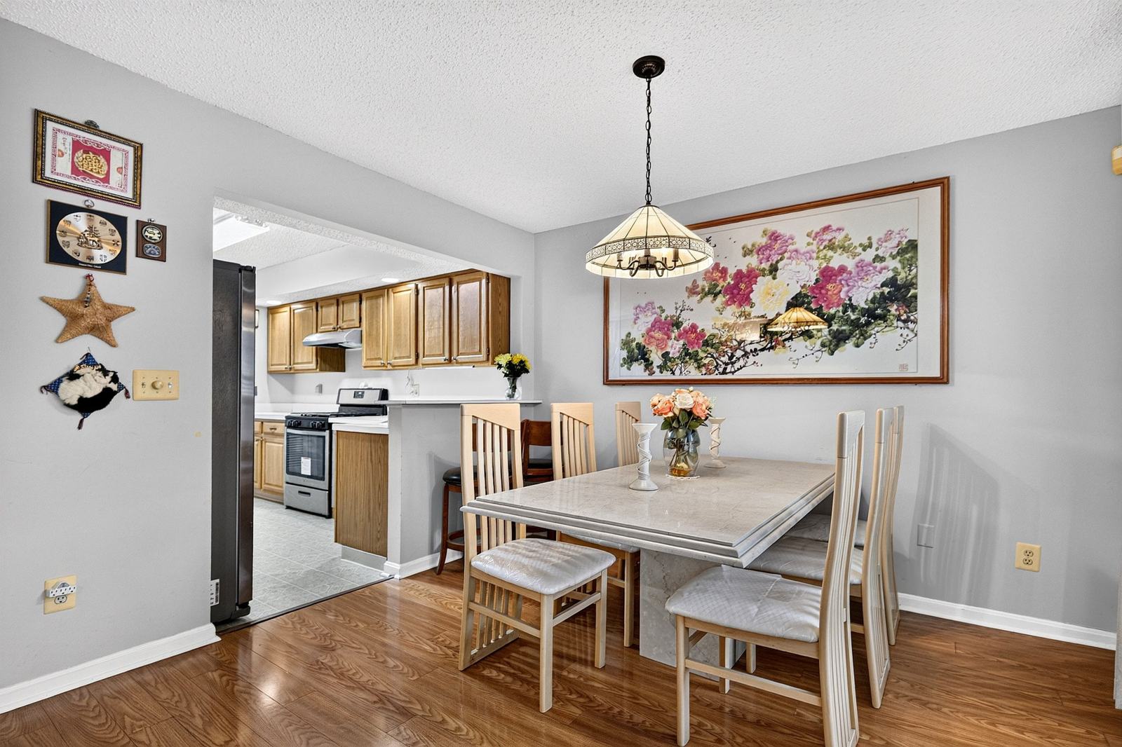 Dining area beside the galley kitchen and its breakfast bar